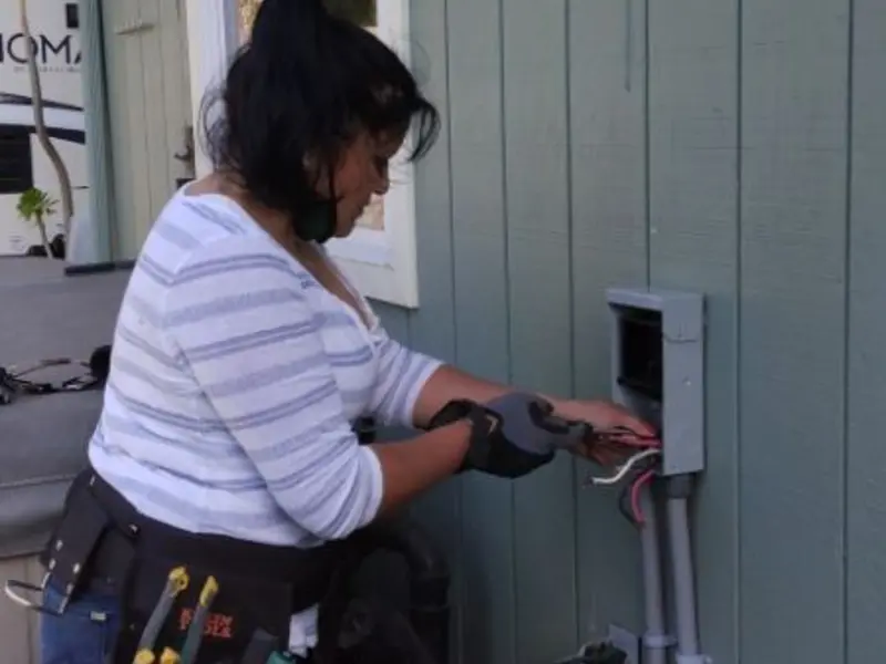 Licensed electrician wiring an exterior subpanel in Lawrence Park