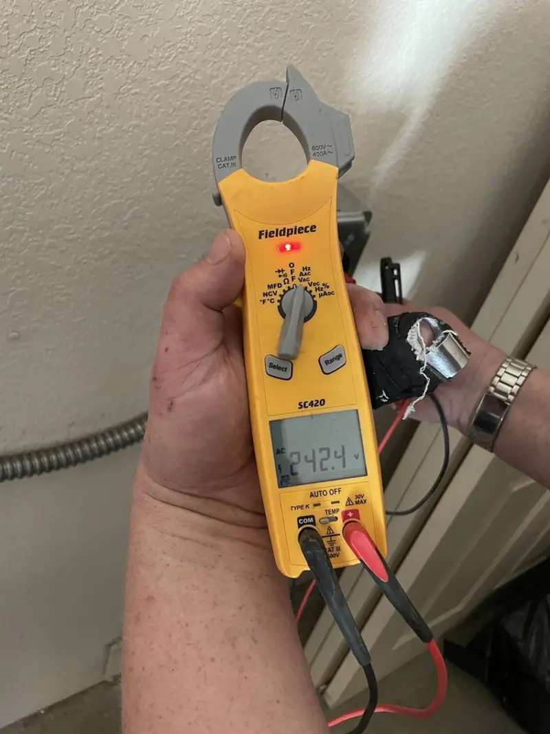 Voltage testing with clamp meter during Electrical Installation Services in Lawrence Park